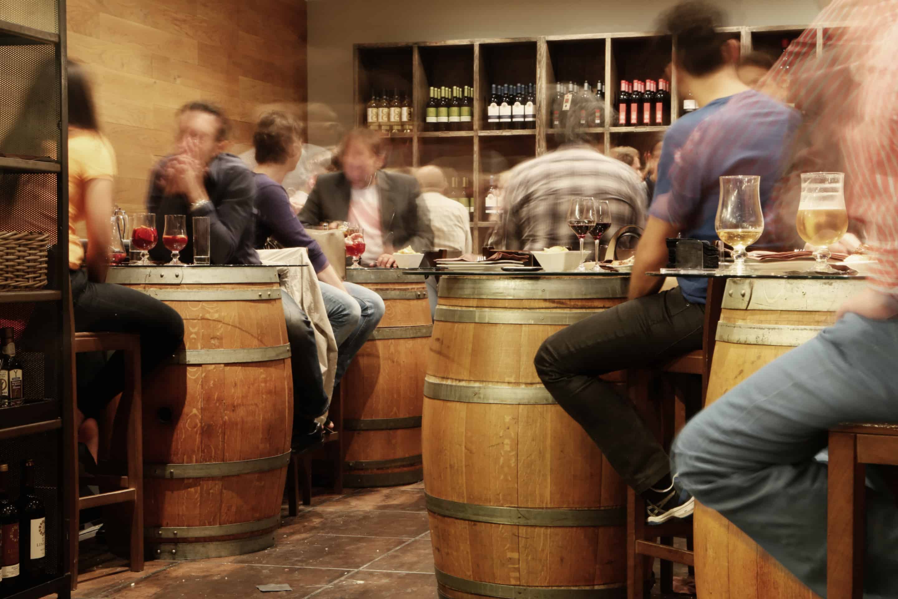 customers in a busy wine cellar