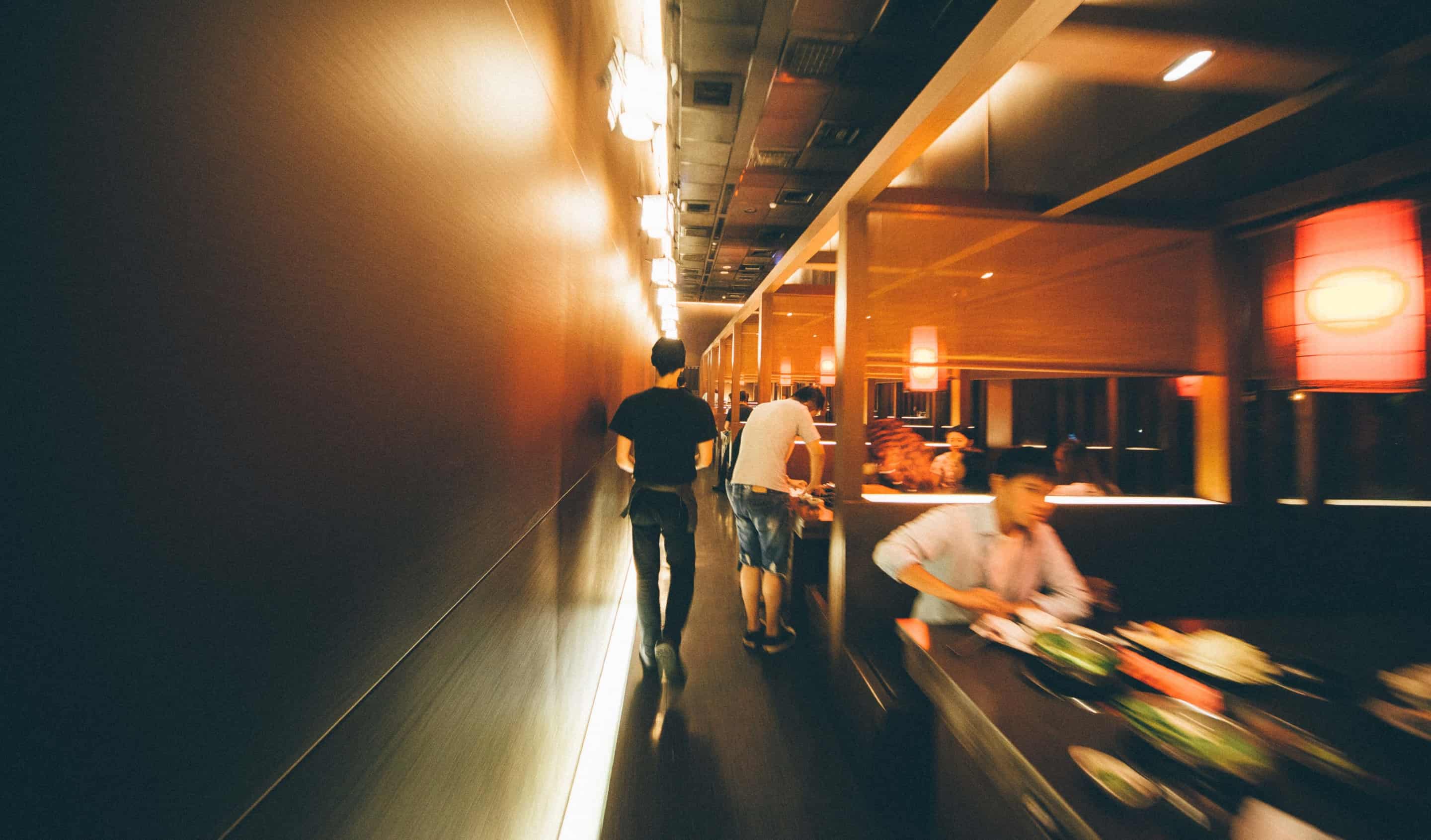 restaurant server walking by tables