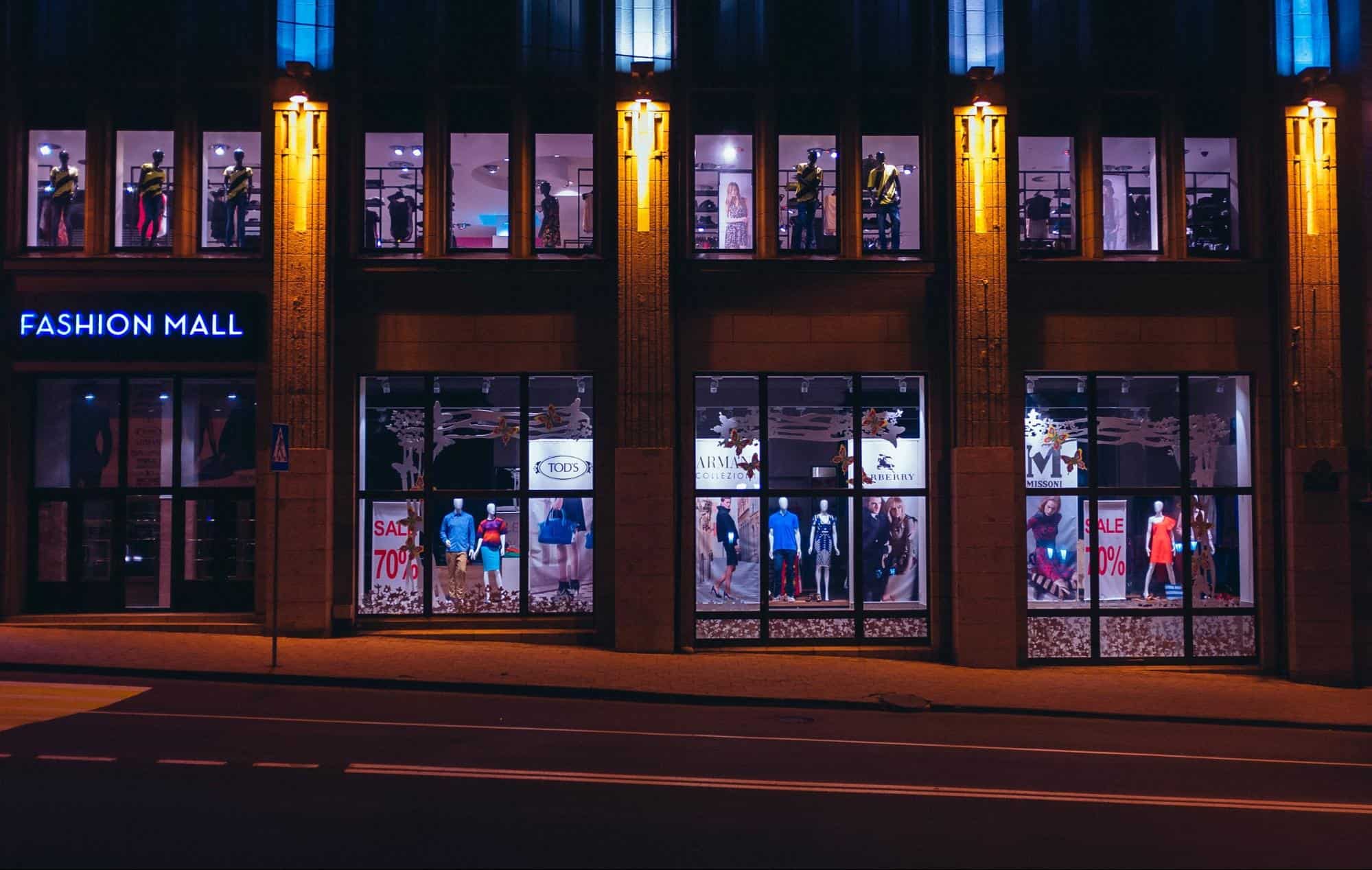a busy mall storefront at night