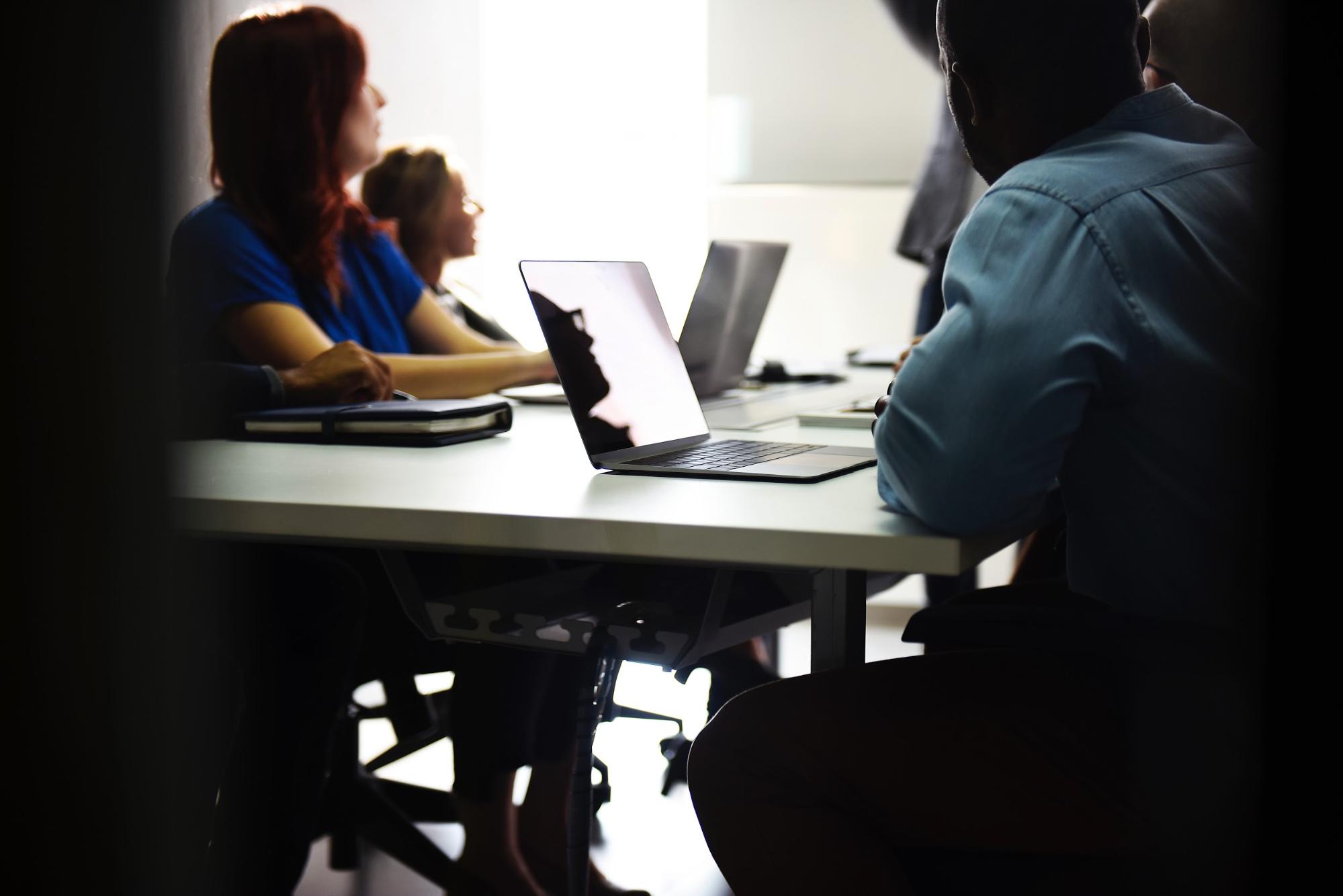 Coworkers having a meeting to discuss exit interview questions