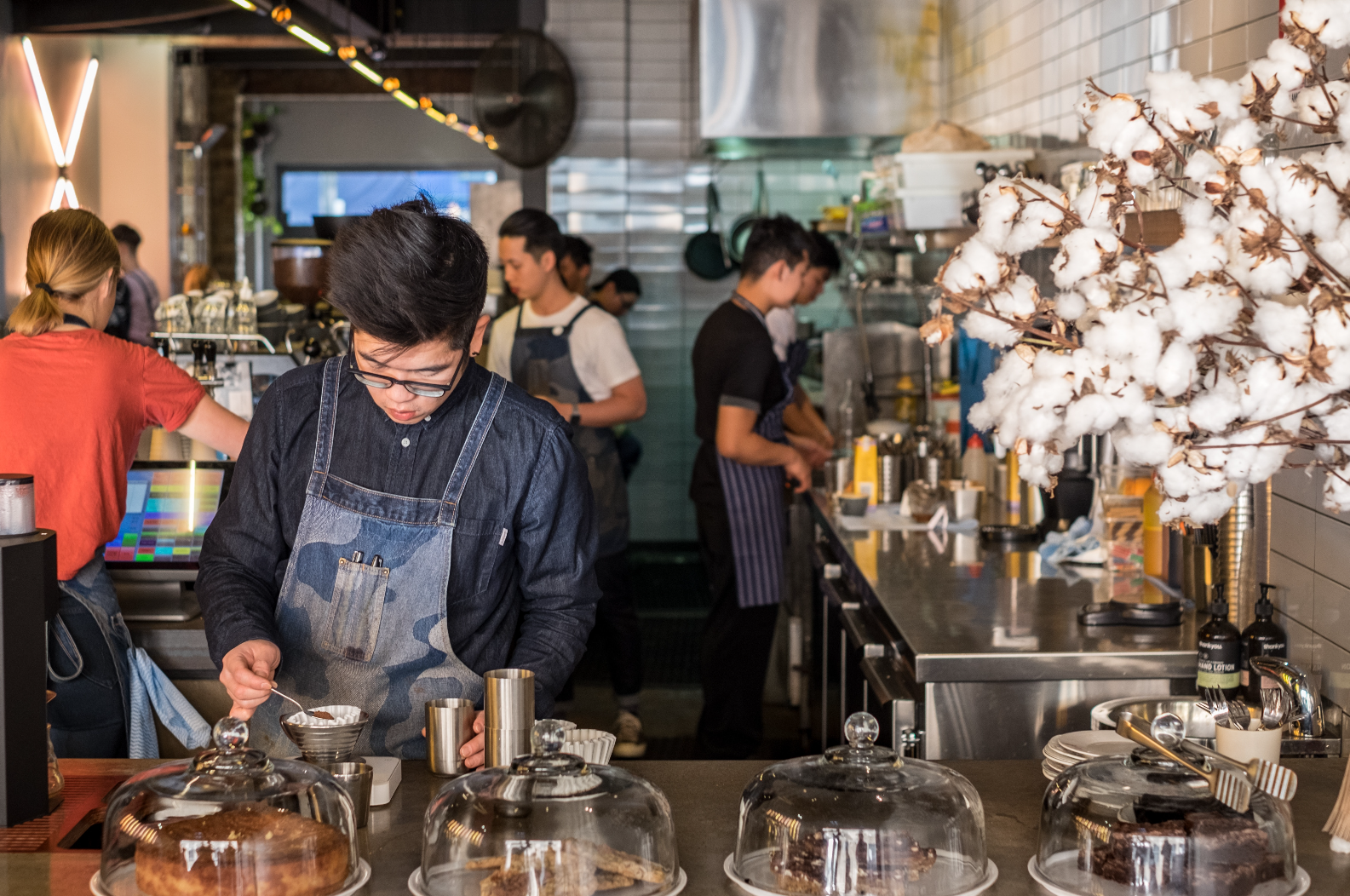 Workers in a cafe preparing for seasonal unemployment