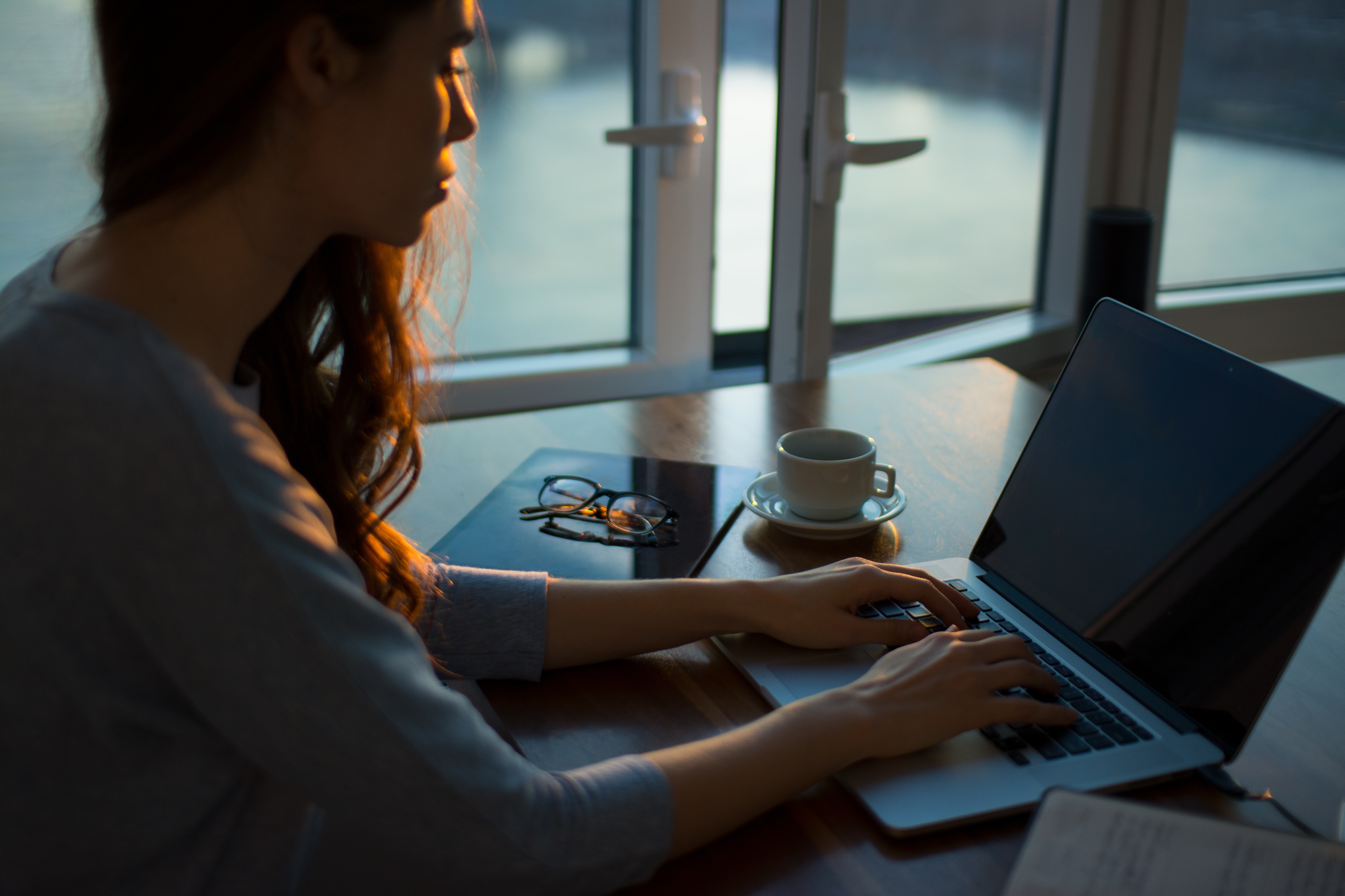 woman writing a customer service job description