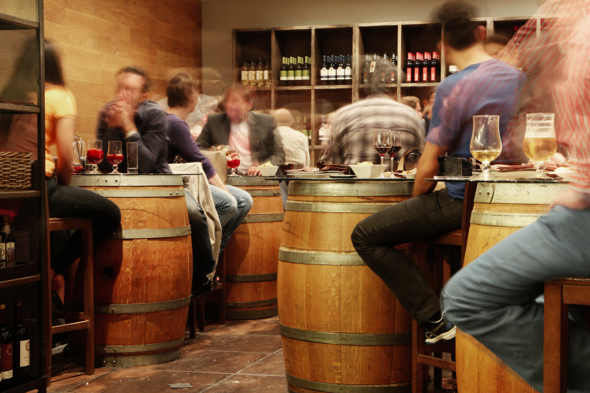 patrons in a wine cellar tasting wine