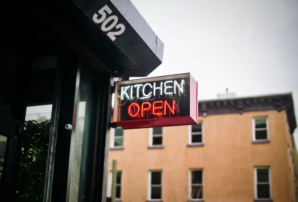 restaurant sign reading kitchen open