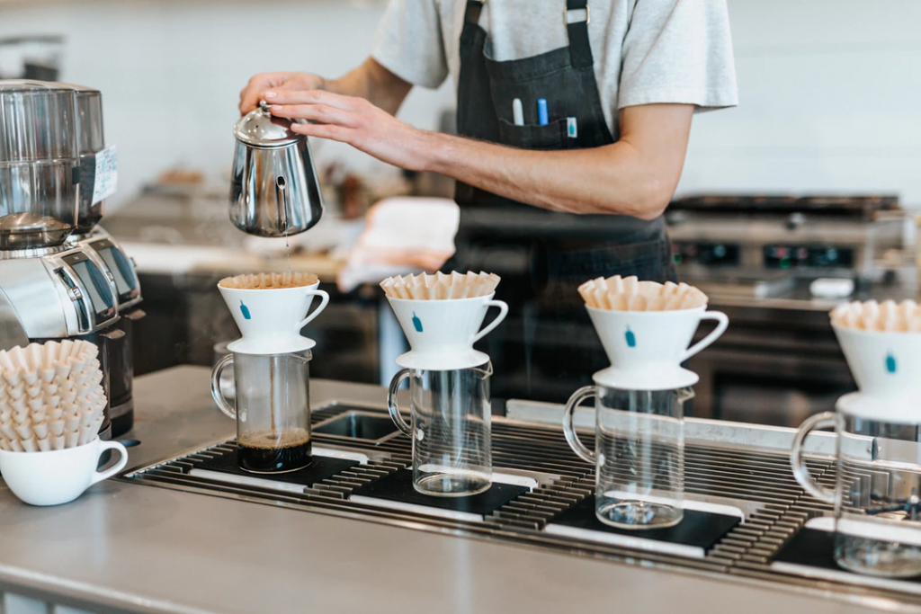 Restaurant manager making coffee