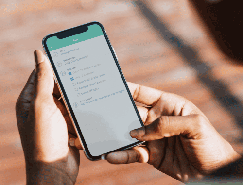 Person reviewing cell phone policy at work