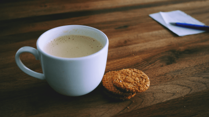 enjoying coffee and cookies while managing restaurant inventory