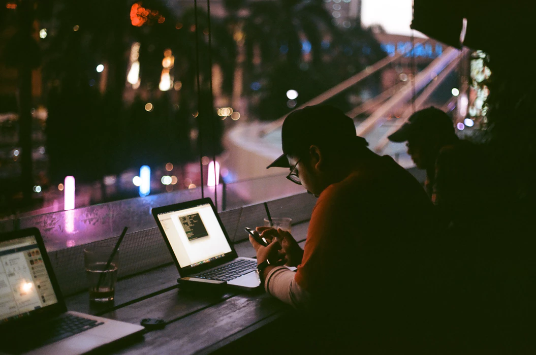 Man working remotely and complying with cell phone policy