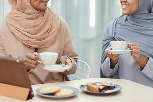 Two women having coffee together