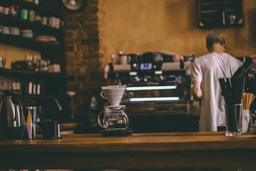 man working in a coffee shop