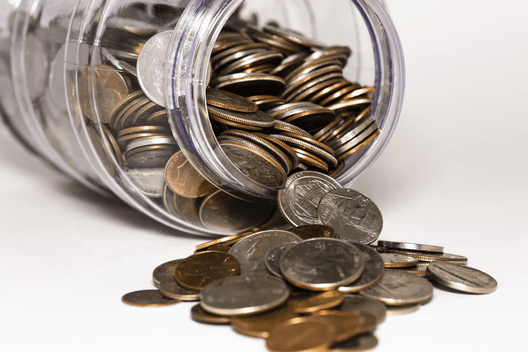 Jar of coins depicting managerial accounting vs. financial accounting