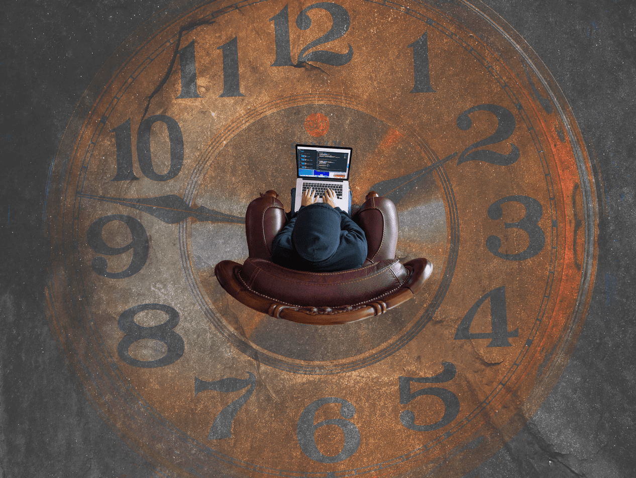 Person sitting in the middle of a clock painting on ground