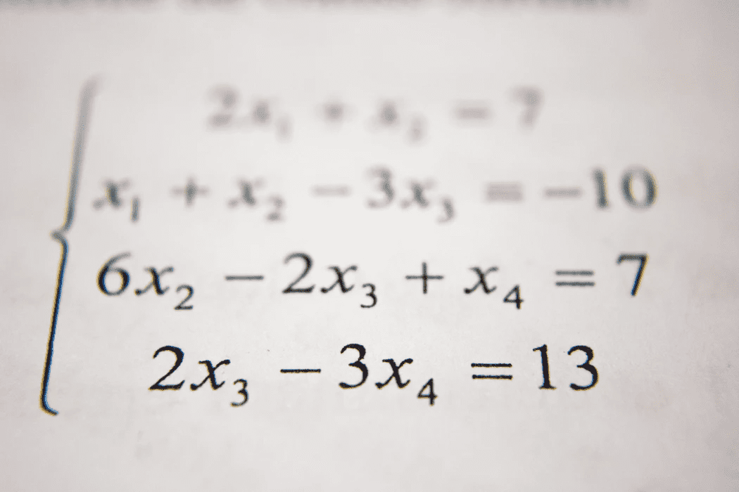 Mathematical formula written on paper to show contribution margin ratio