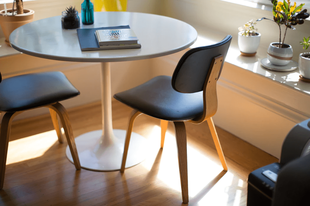 table with chairs and books for brainstorming