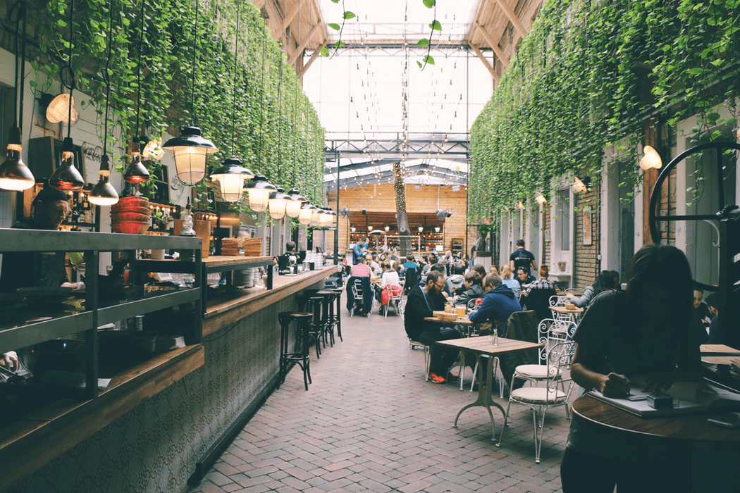 People dining at a restaurant with outdoor seating