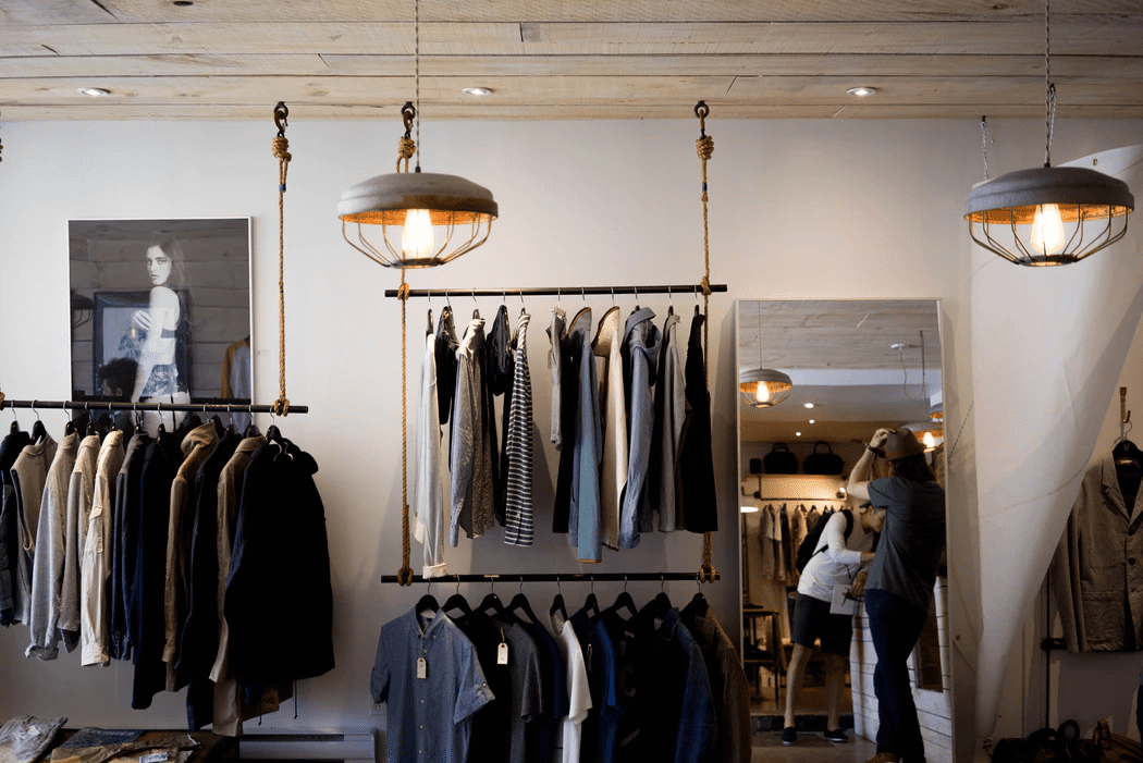 clothing on racks at a retail store