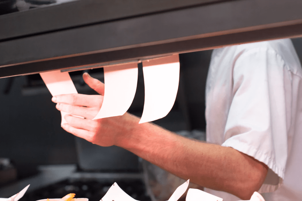 Food orders in the kitchen of a virtual restaurant