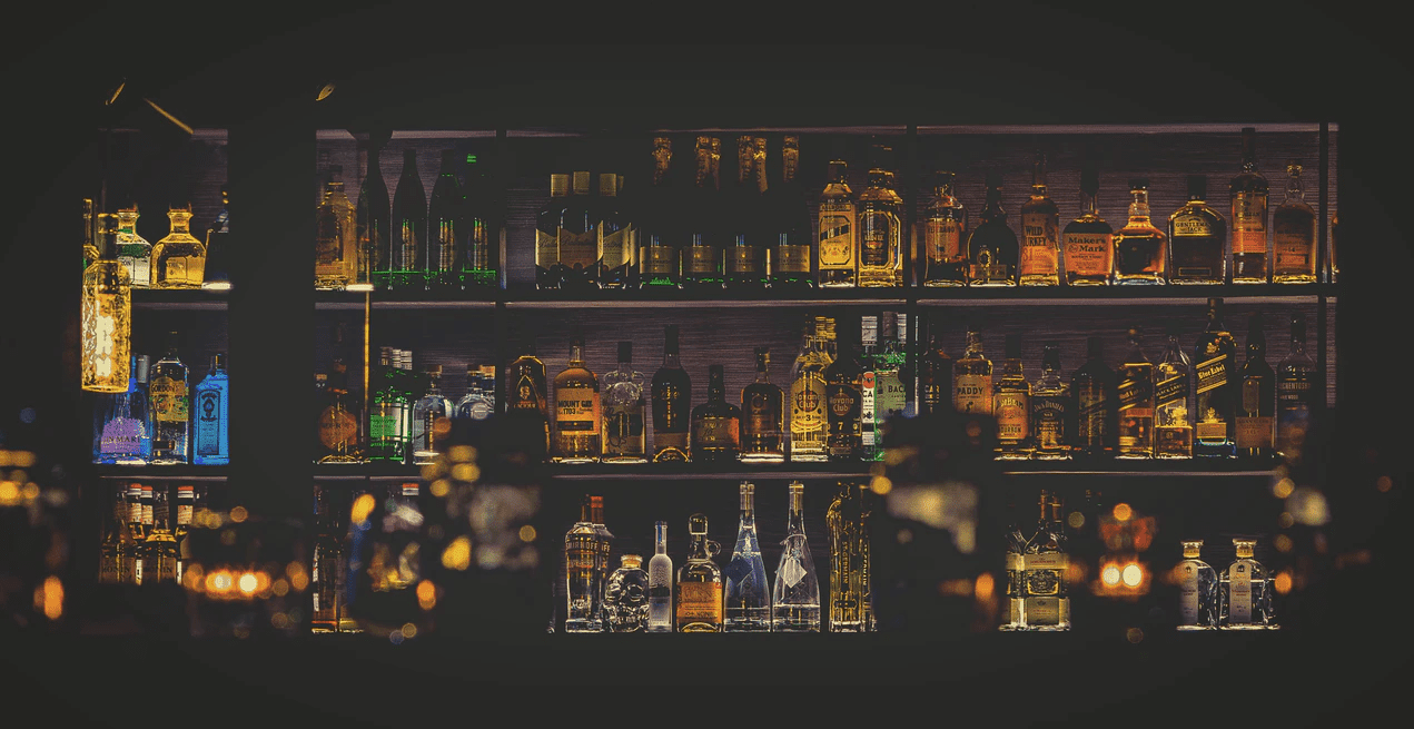 Bar inventory on shelves in a bar
