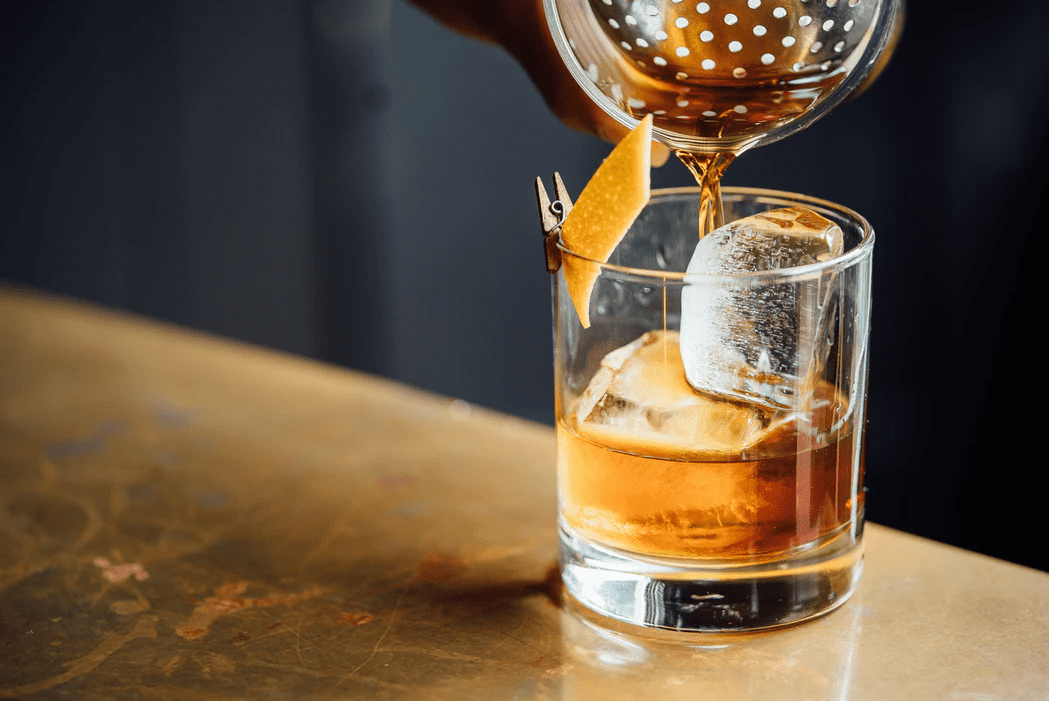 Drink being poured in a bar