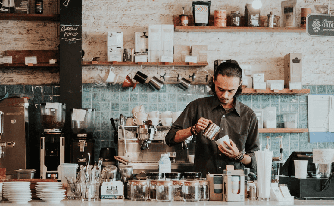 man working at a coffee shop