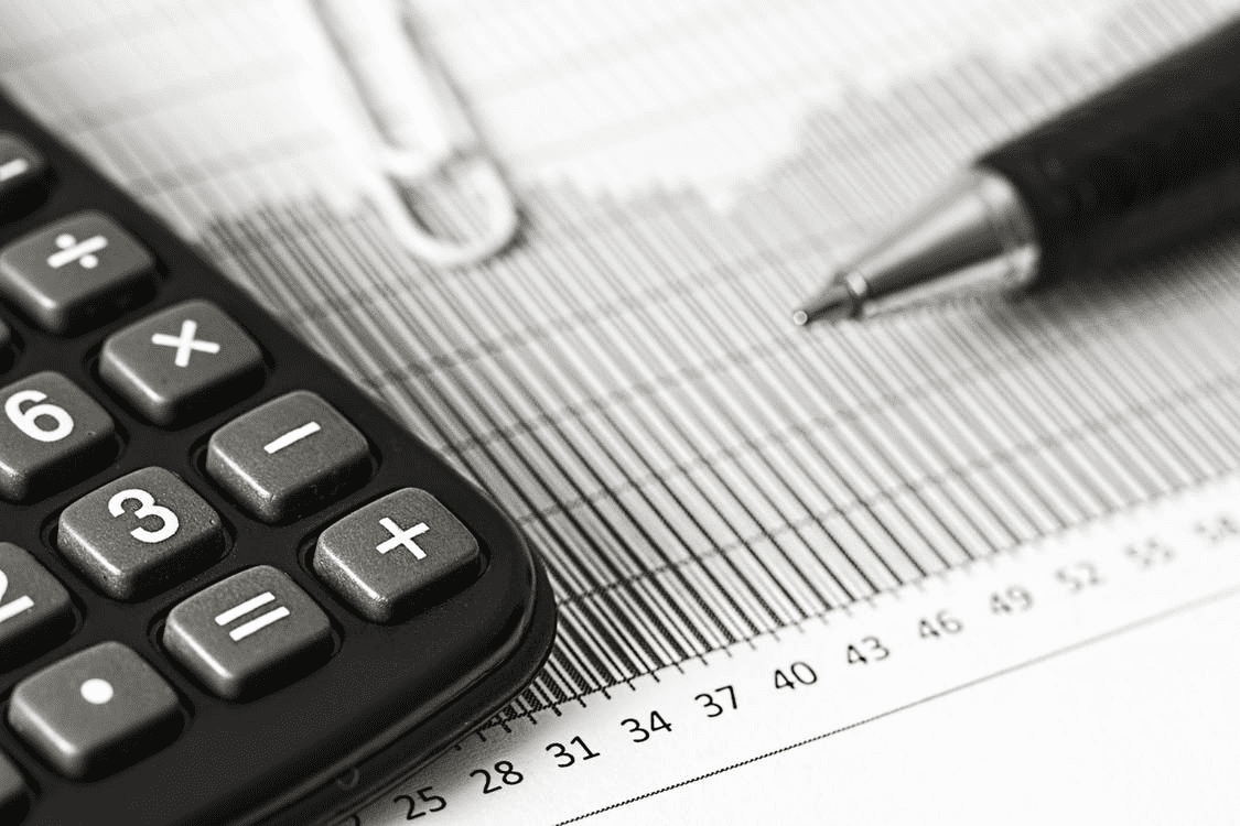 Pen and calculator on a graph of PTO accrual