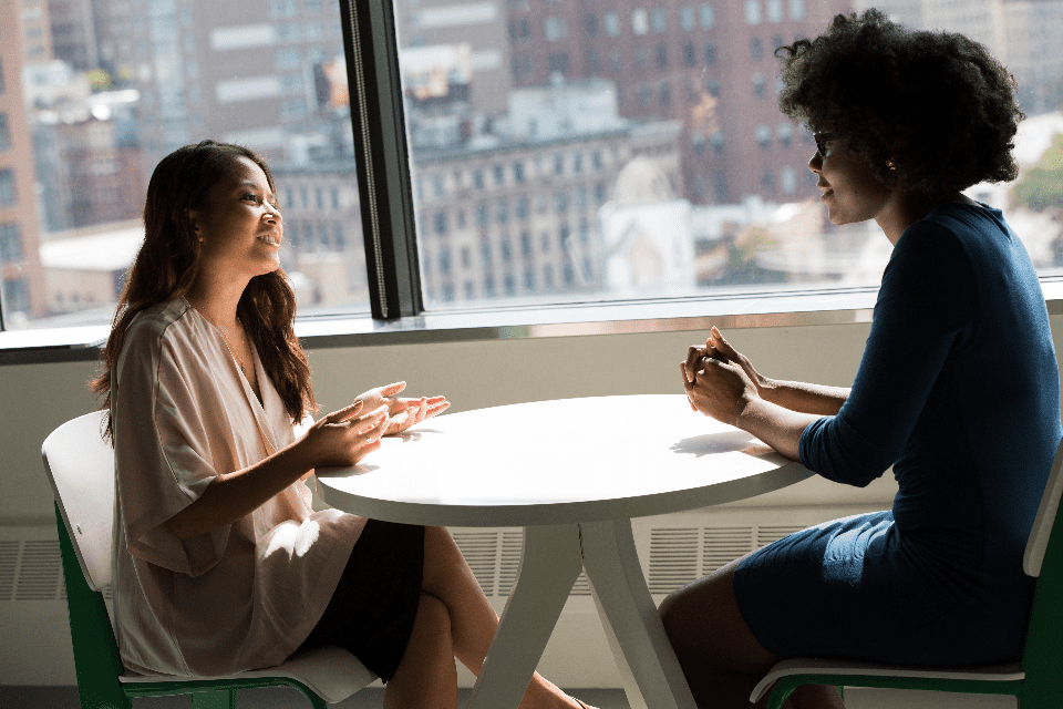 two female entrepreneurs discussing starting a small business