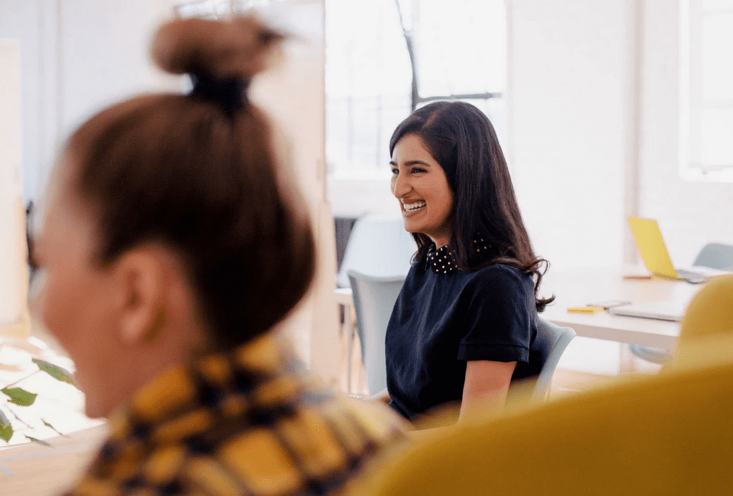 2 Women playing ice-breaker games at work