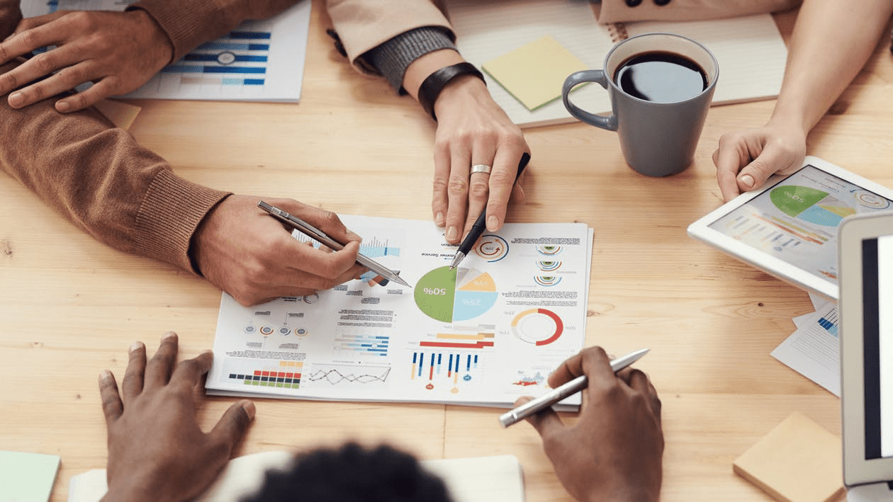 coworkers using graphs and charts to plan strategic human resource management