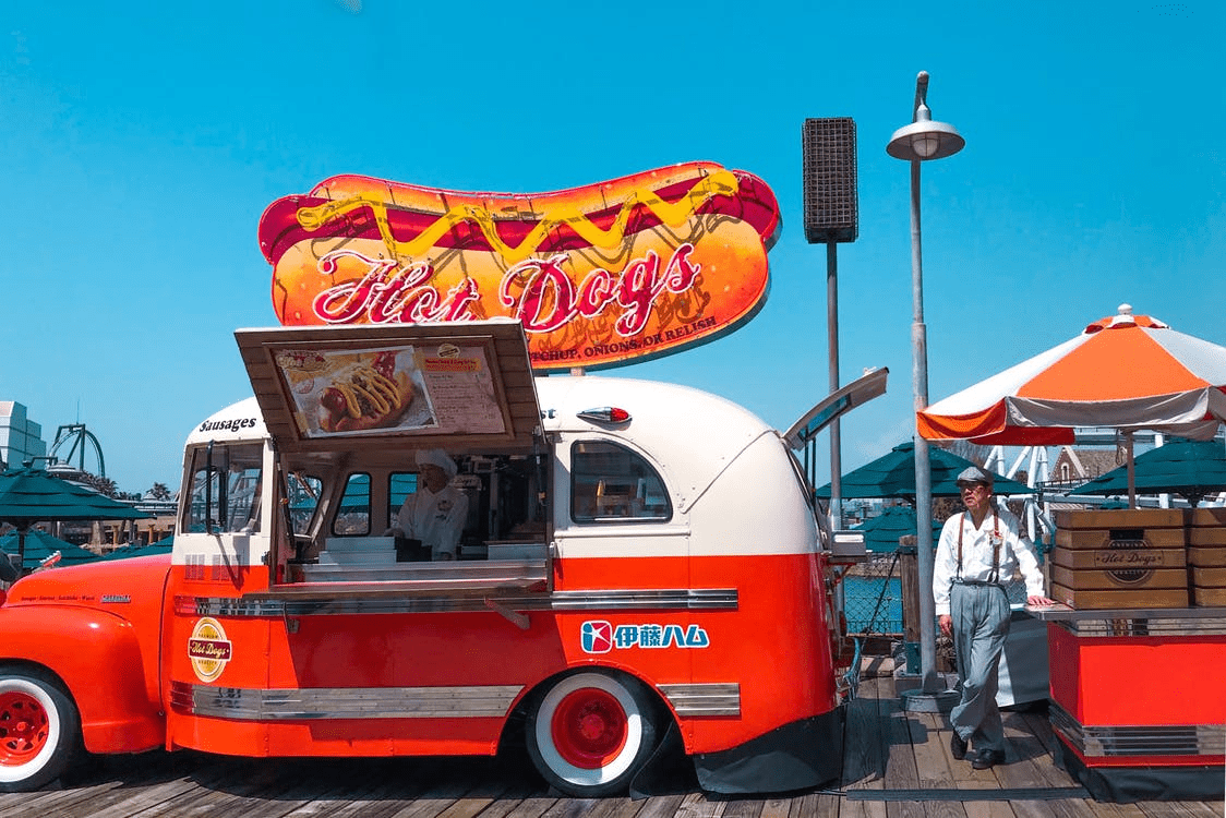 hot dog food truck on a boardwalk 