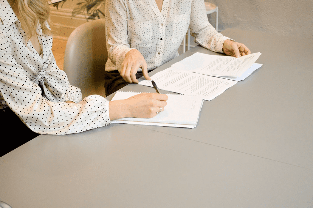 two business women discussing job abandonment