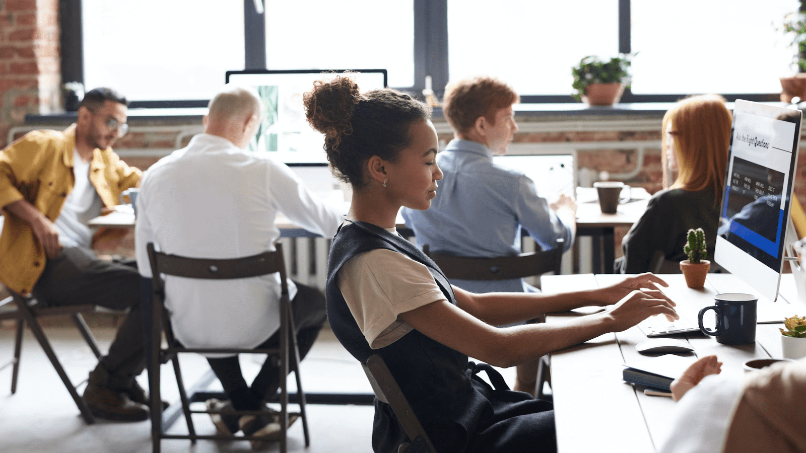 woman working at her computer on leave management 