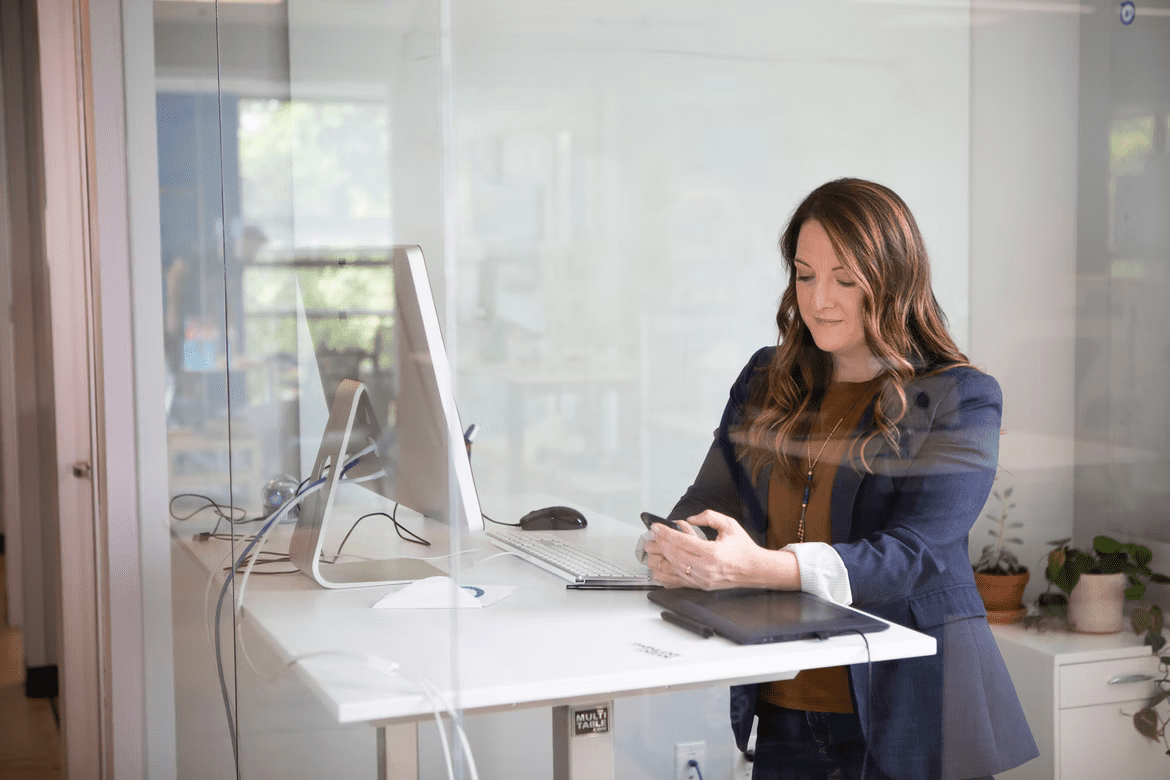 Woman working at stand up desk