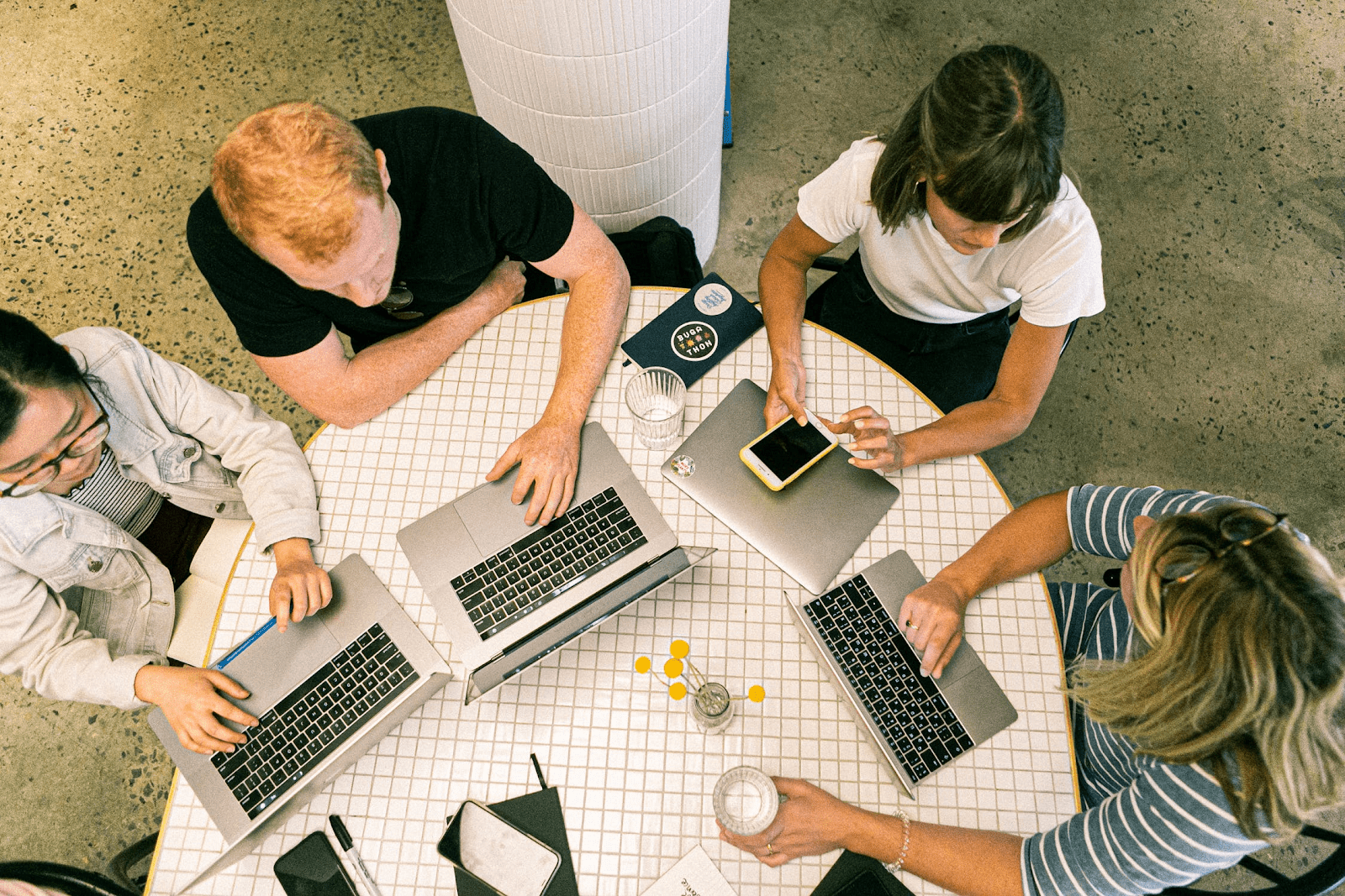 Group of employees working on laptops
