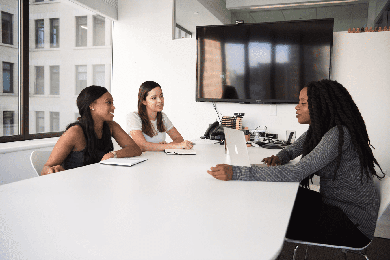 Three employees in a meeting