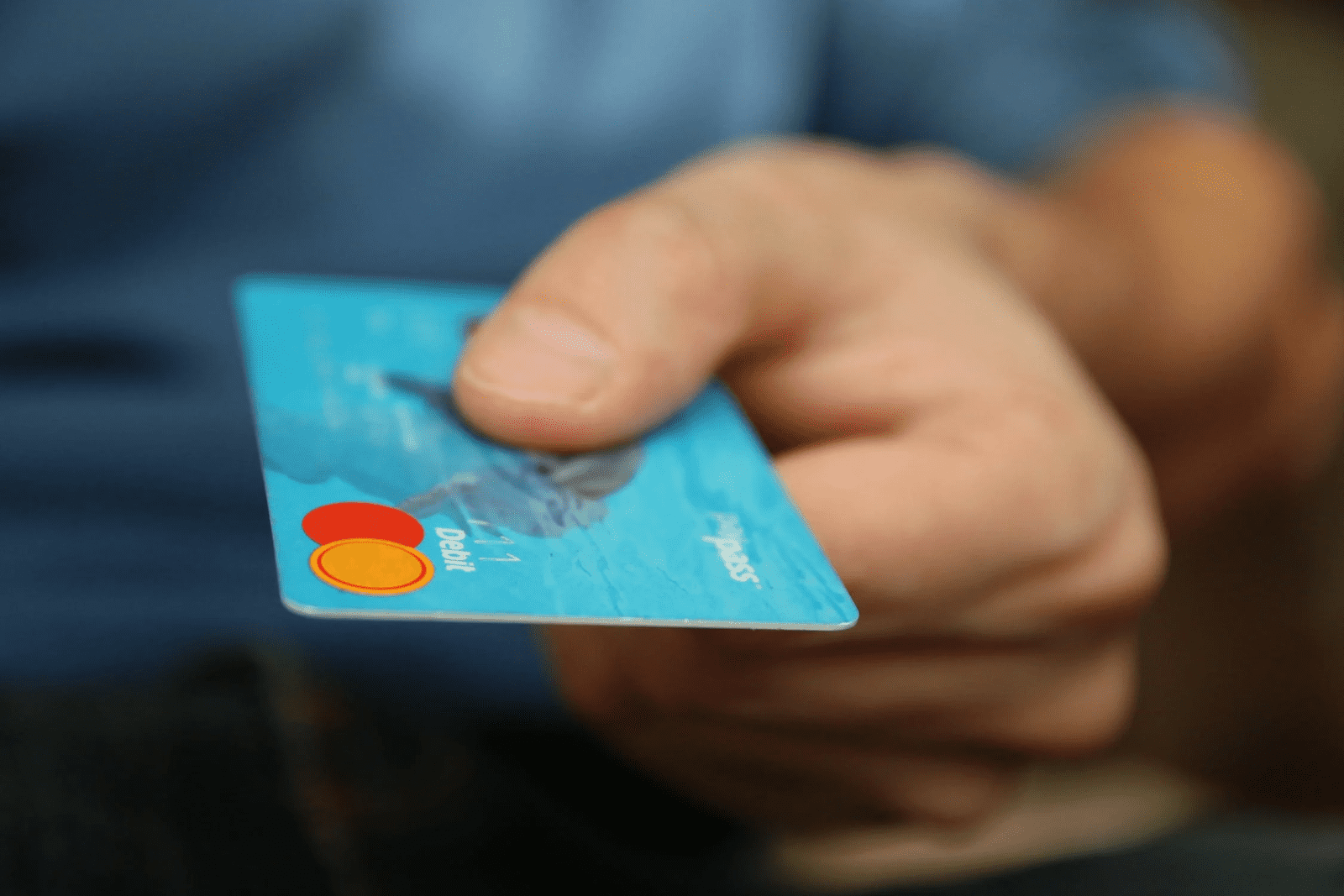 Man holding debit card