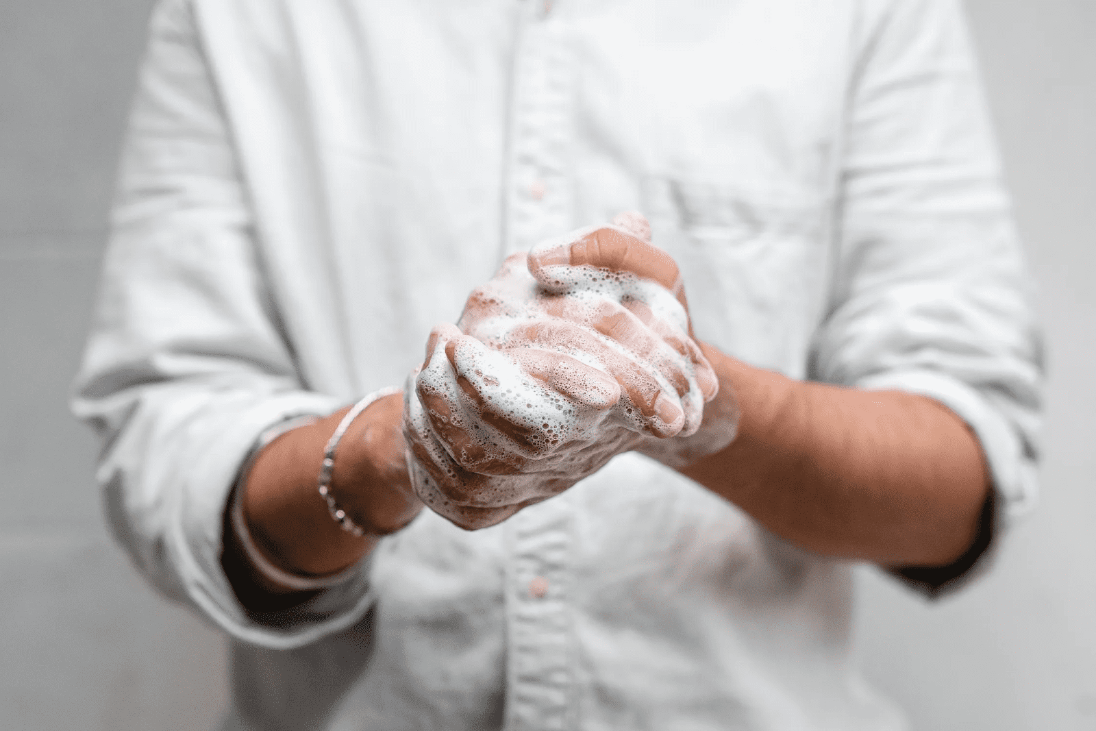 Man washing his hands after learning how to clean a restaurant