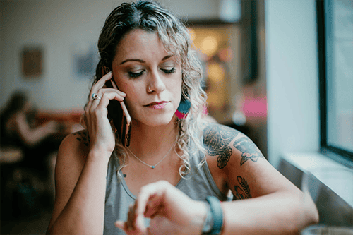 Employee committing time theft by taking a personal call at work