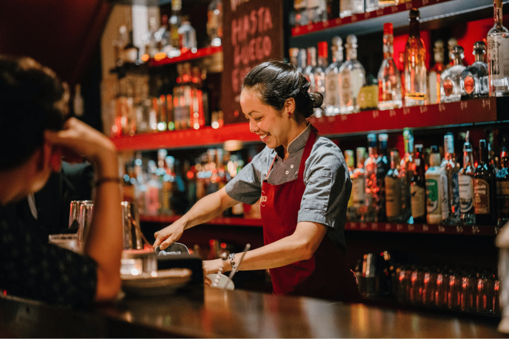 Bartender serving up a drink to increase customer loyalty