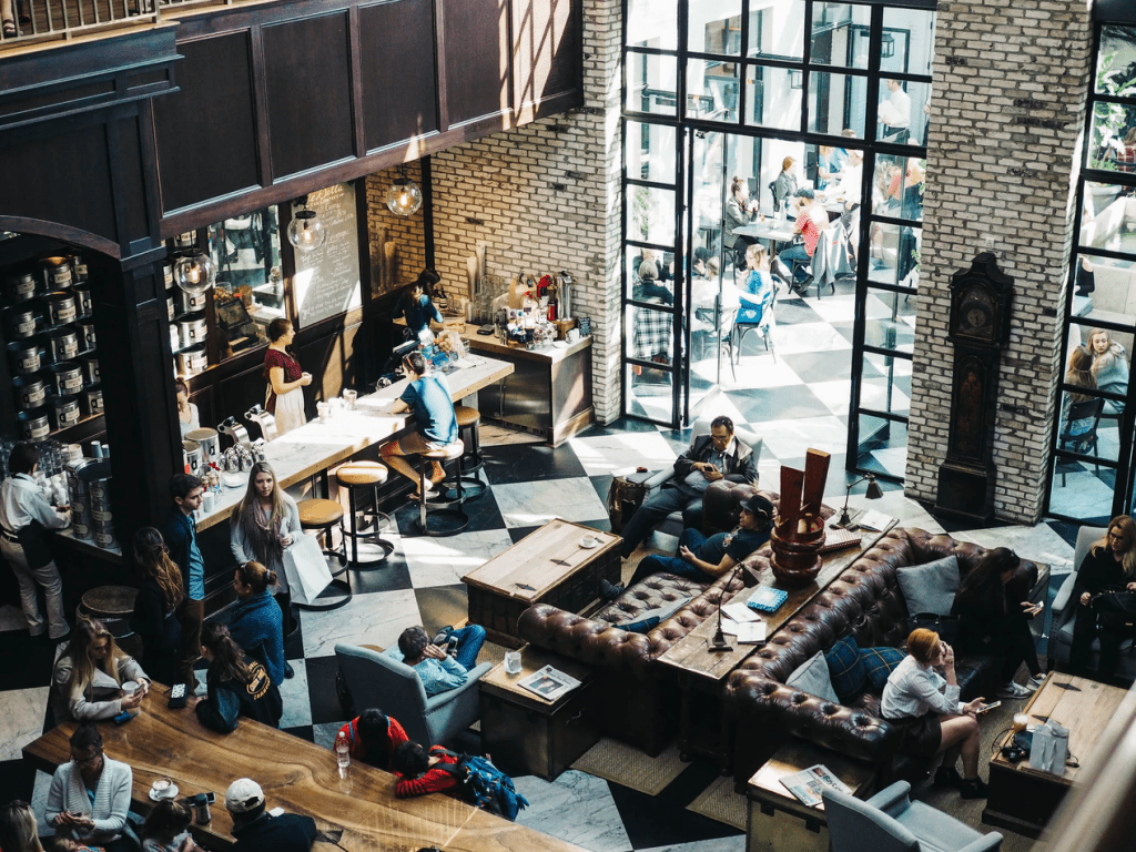 Overhead view of a coffee shop that staffs both FLSA exempt and non exempt employees