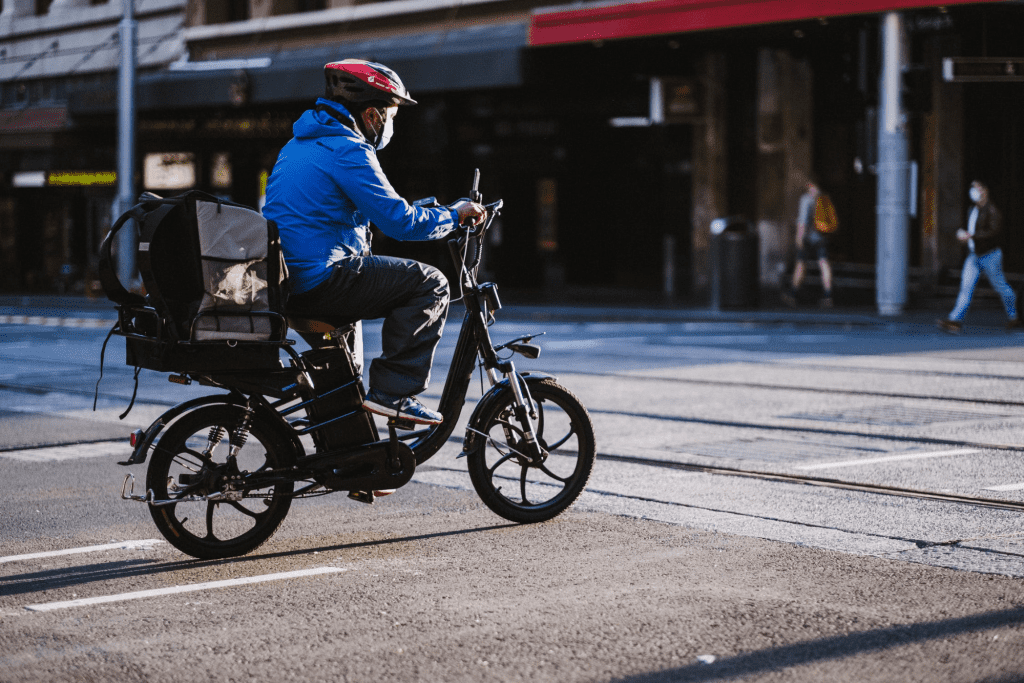 Man riding a bike for delivery service