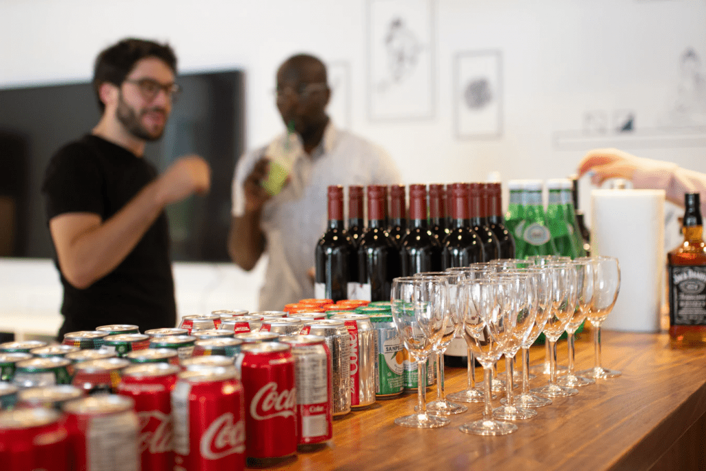 Two employees prepping drinks for one of the employee appreciation ideas