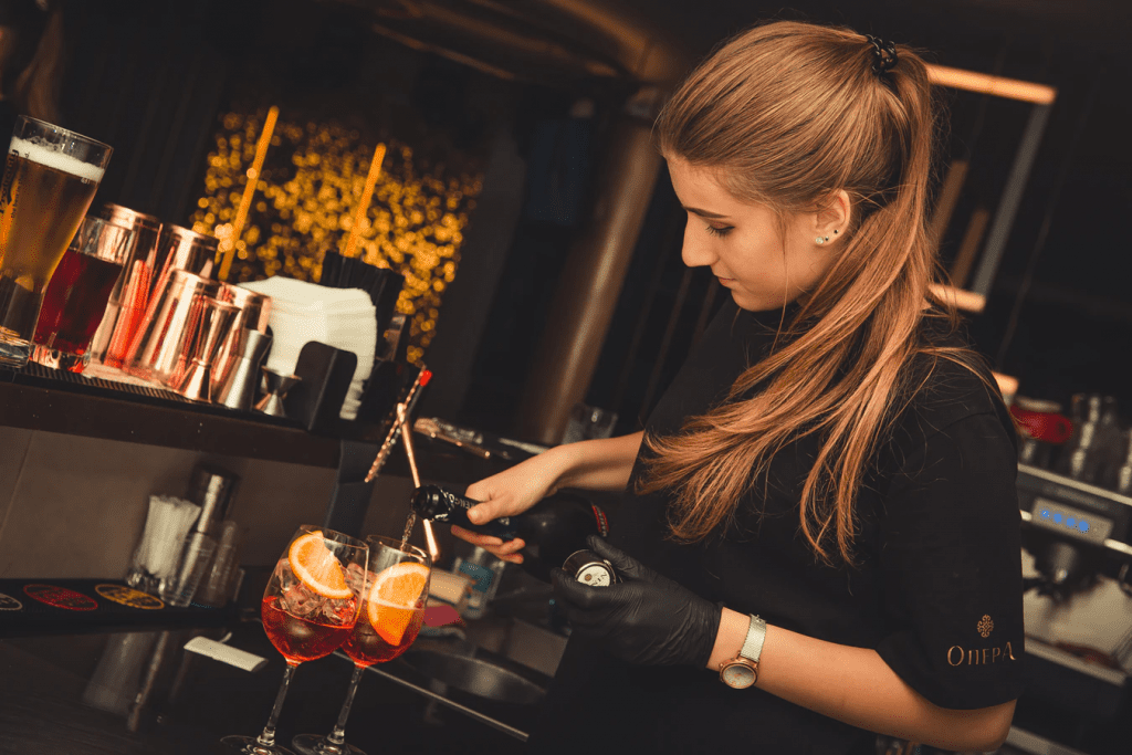 Bartender serving up sangria behind the bar