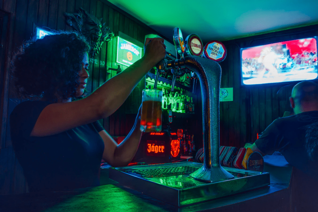 Bartender pouring a beer after using suggestive selling