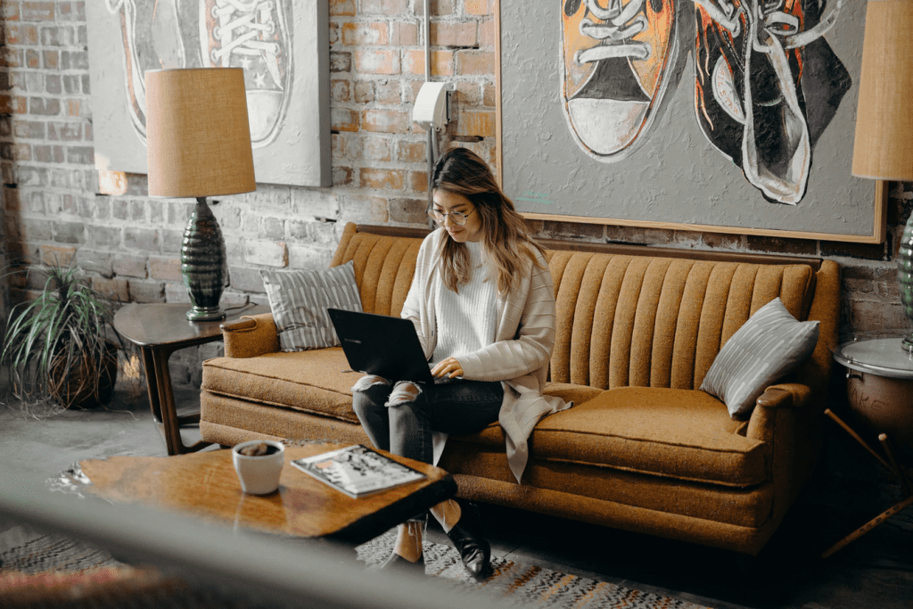 Woman working on her own laptop at coffee shop