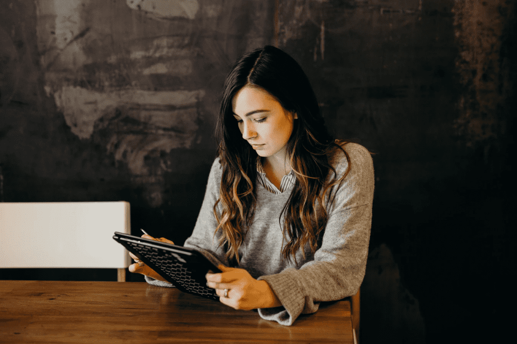 Woman working on her own tablet for a BYOD job