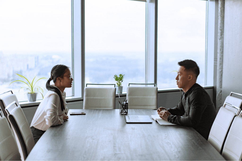 Two employees working at a company with an open door policy