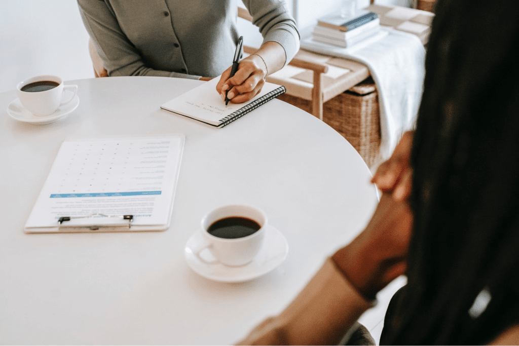 Two employees having coffee together