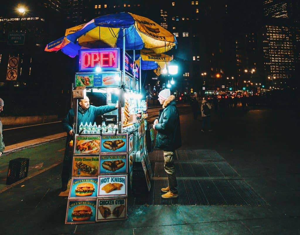 Food truck serving at night on city streets