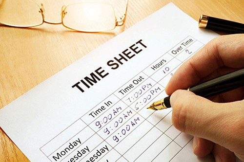 Person filling out timesheets