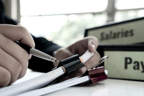 Person filing out personal file paper work